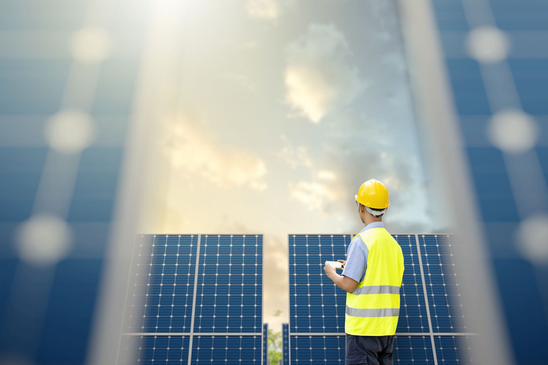 Engineer inspecting solar modules on site